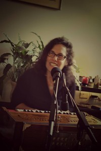 Ellen "Radha" Katz at the harmonium during Bhakti Caravan rehearsal